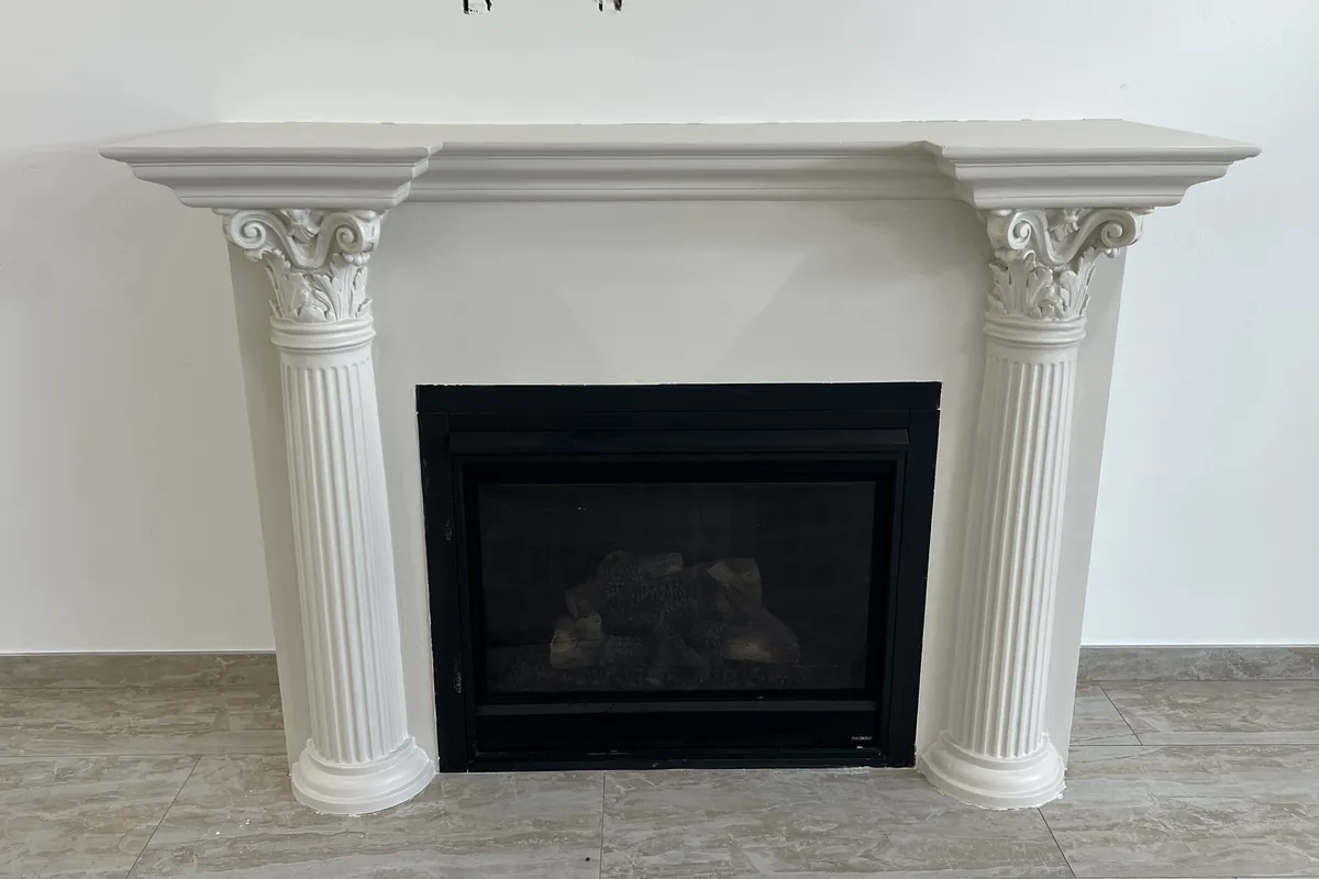 Fireplace mantel and columns finished in white, a Tony's Painting job in San Diego County