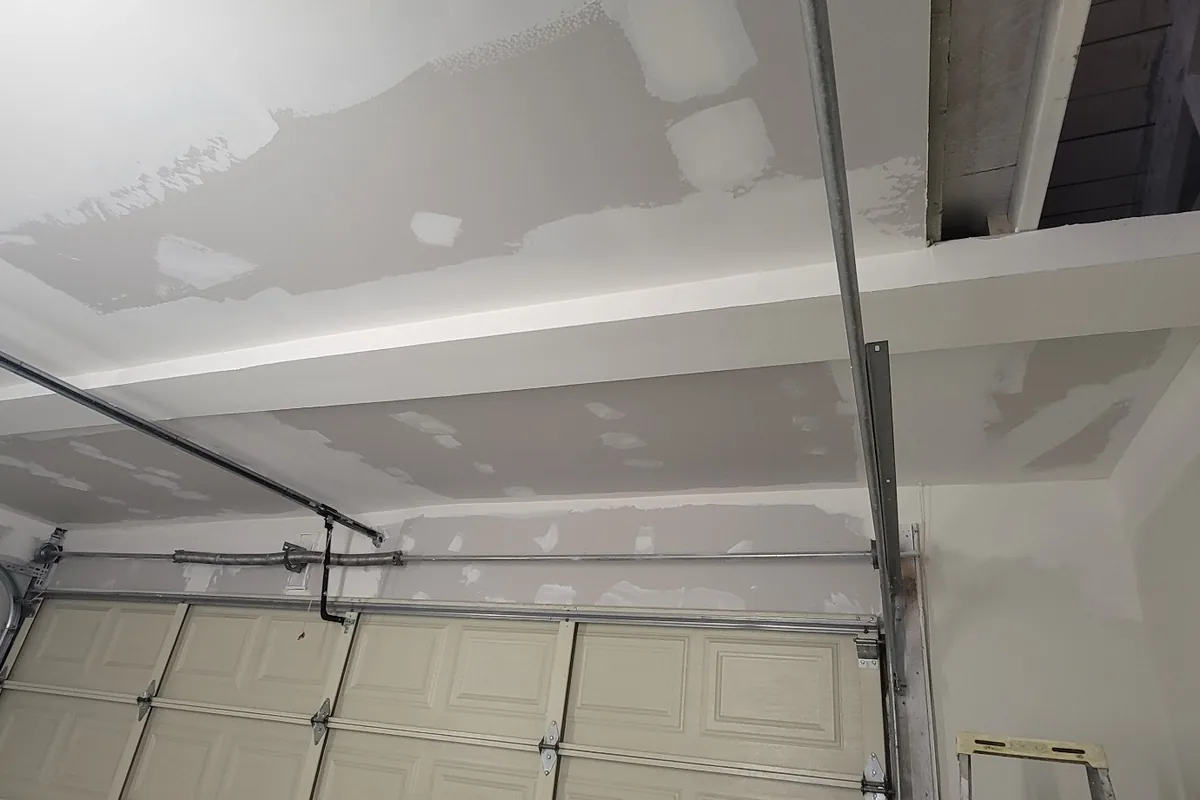 Finished garage ceiling and wall after repair, a Tony's Painting job in San Diego County