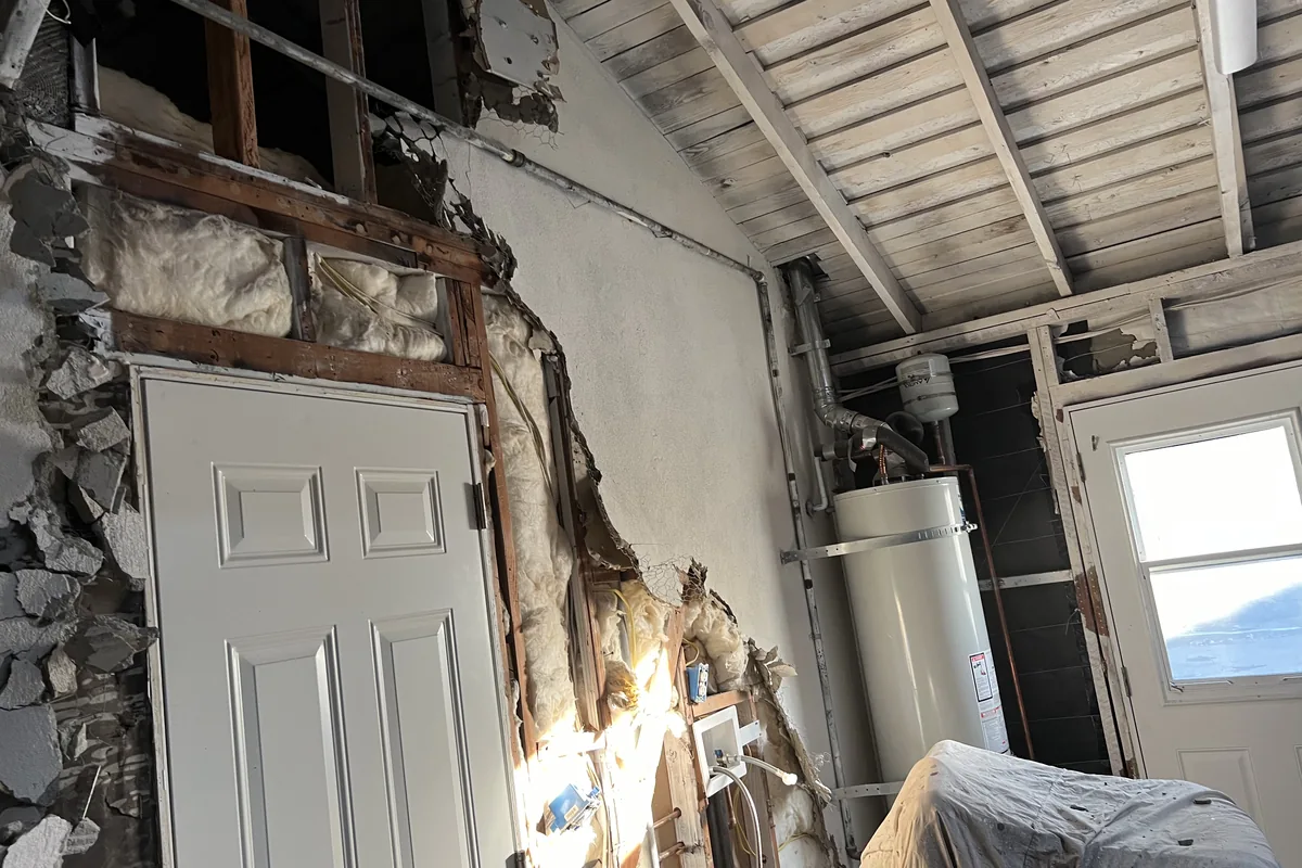 Framing and sheathing exposed before the rebuild, a Tony's Painting job in San Diego County